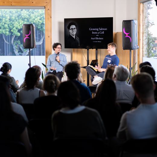 Aryé Elfenbein in conversation with a seated audience at a World's Fair Co. talk.